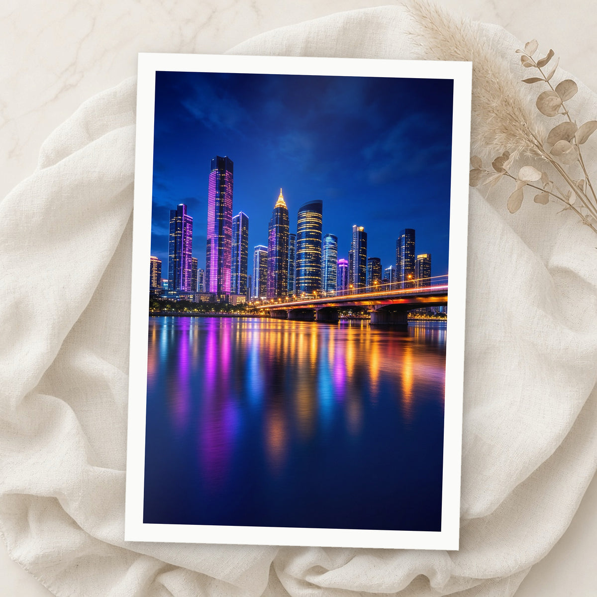 Example print: vivid city skyline at night reflected in a river, printed on Moab Slickrock Metallic Pearl paper