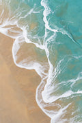 Ethereal Shore – aerial view of turquoise ocean waves meeting golden sandy shore with delicate white foam patterns