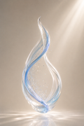 Azure Drift – minimalist clear crystal glass sculpture with a blue spiral vein, floating in soft warm light