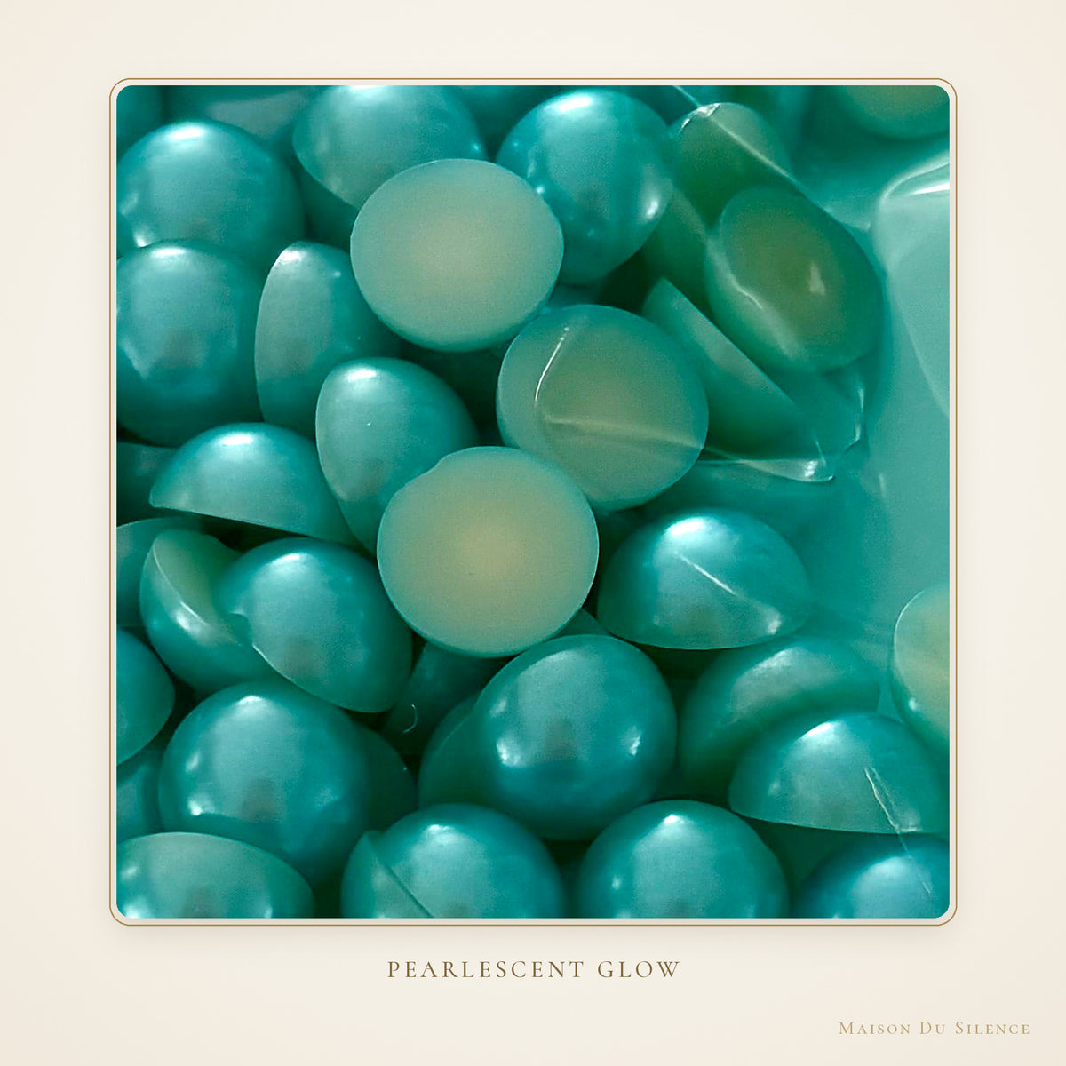 Close-up of aquamarine 12 mm half pearls with a pearlescent glow