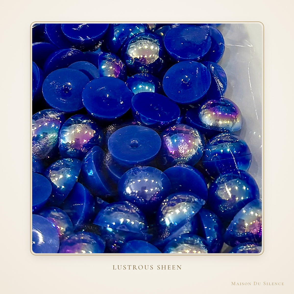 Close-up of deep sapphire blue 12 mm half pearls with a lustrous sheen