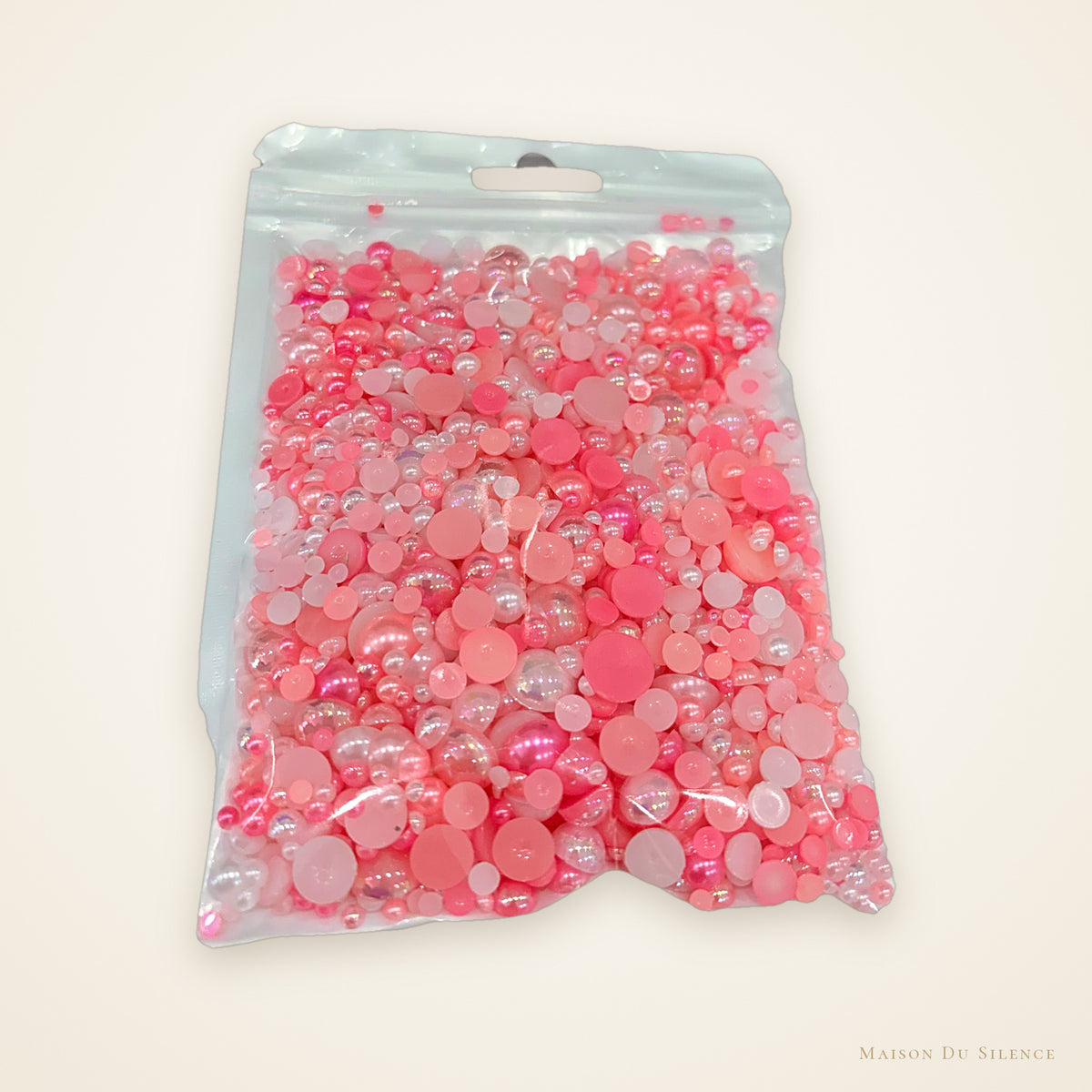 Bag of pink half pearl mix, 60g, in assorted pinks and mixed sizes