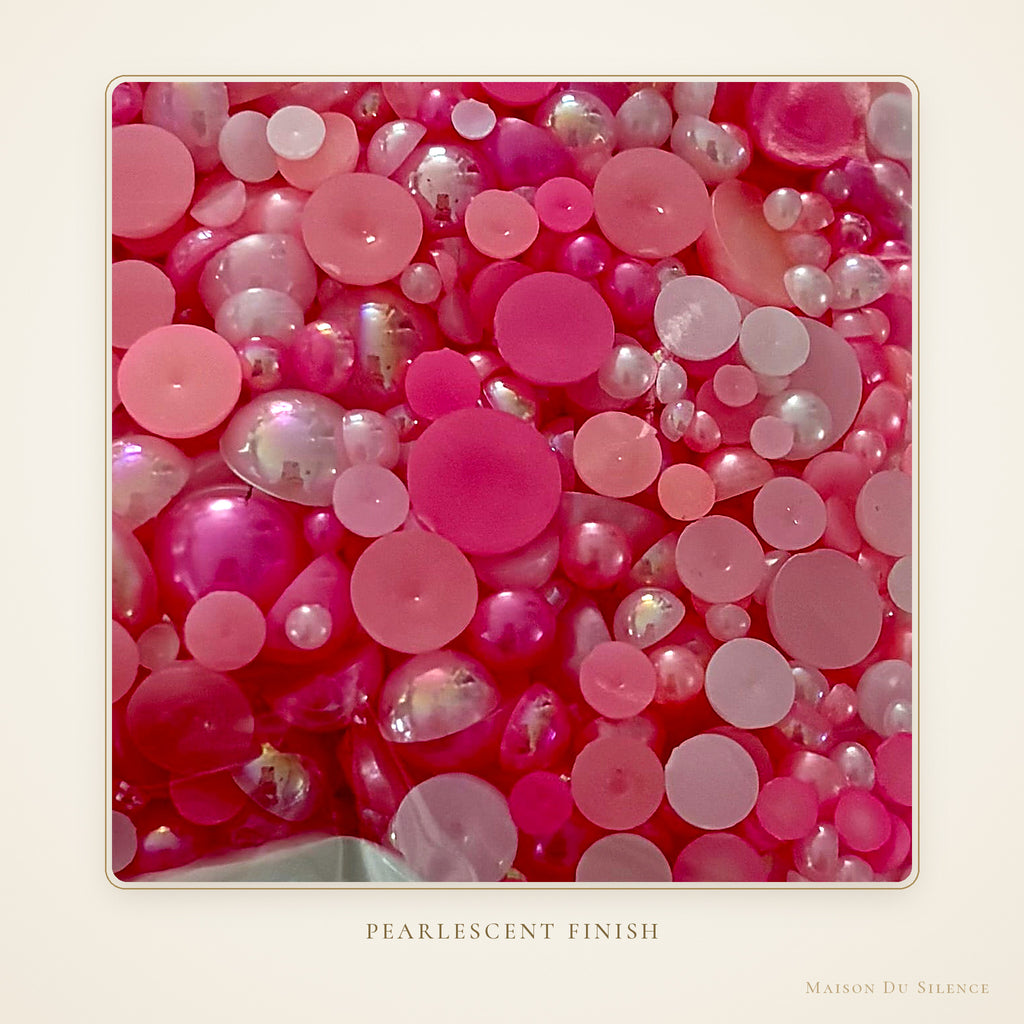 Close-up of pink pearlescent 8 mm half pearls