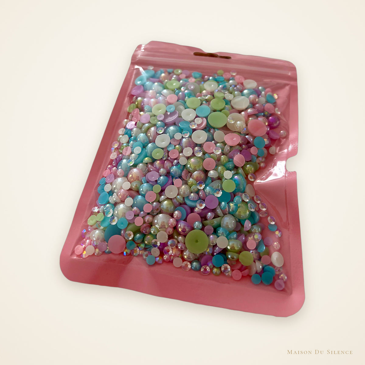 Pink bag of pastel AB half pearl mix, 60g, in mixed sizes