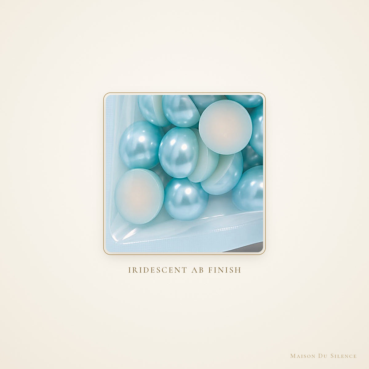 Close-up of aqua teal 10 mm flatback pearls with an iridescent AB sheen