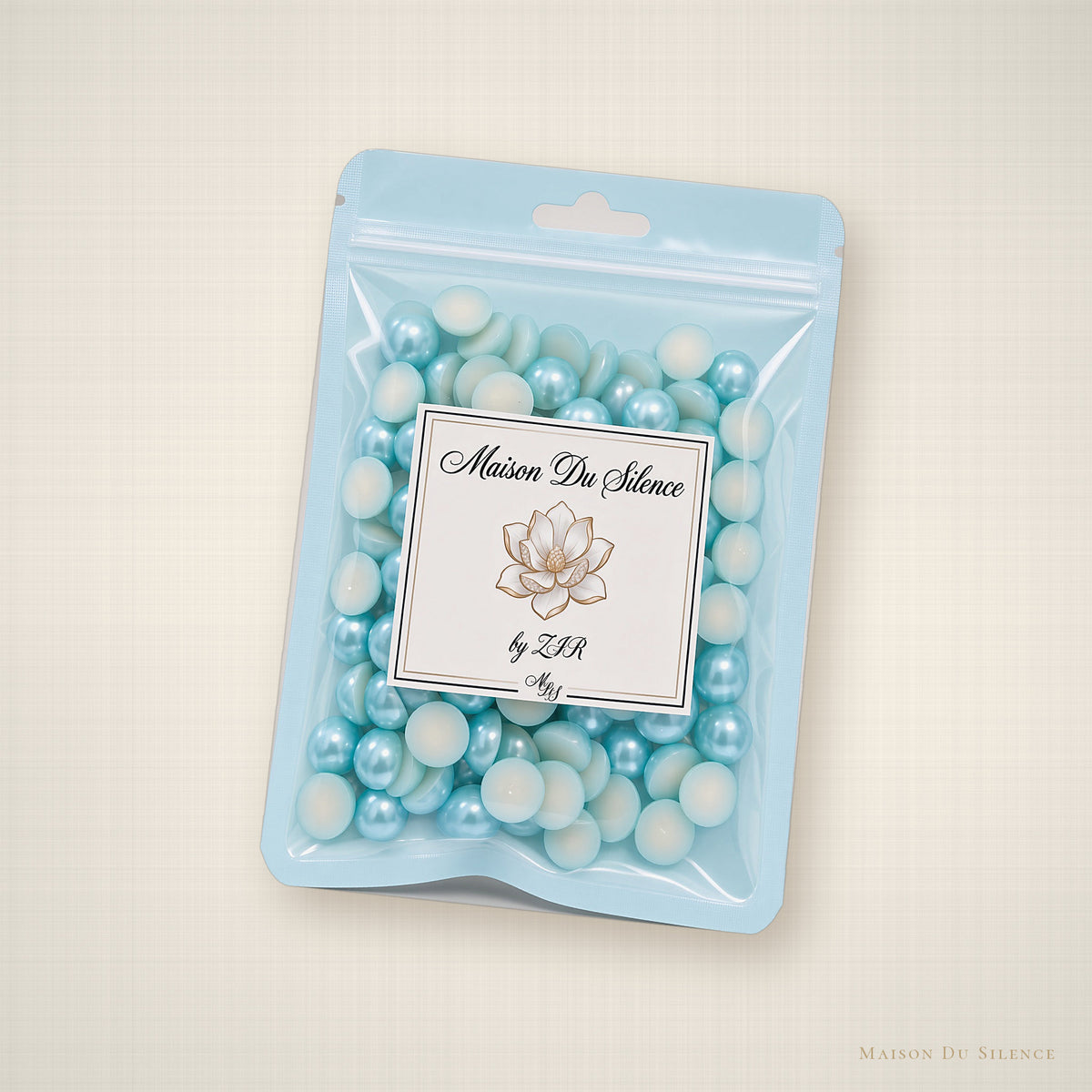 Aqua teal flatback pearls styled on an ivory linen backdrop