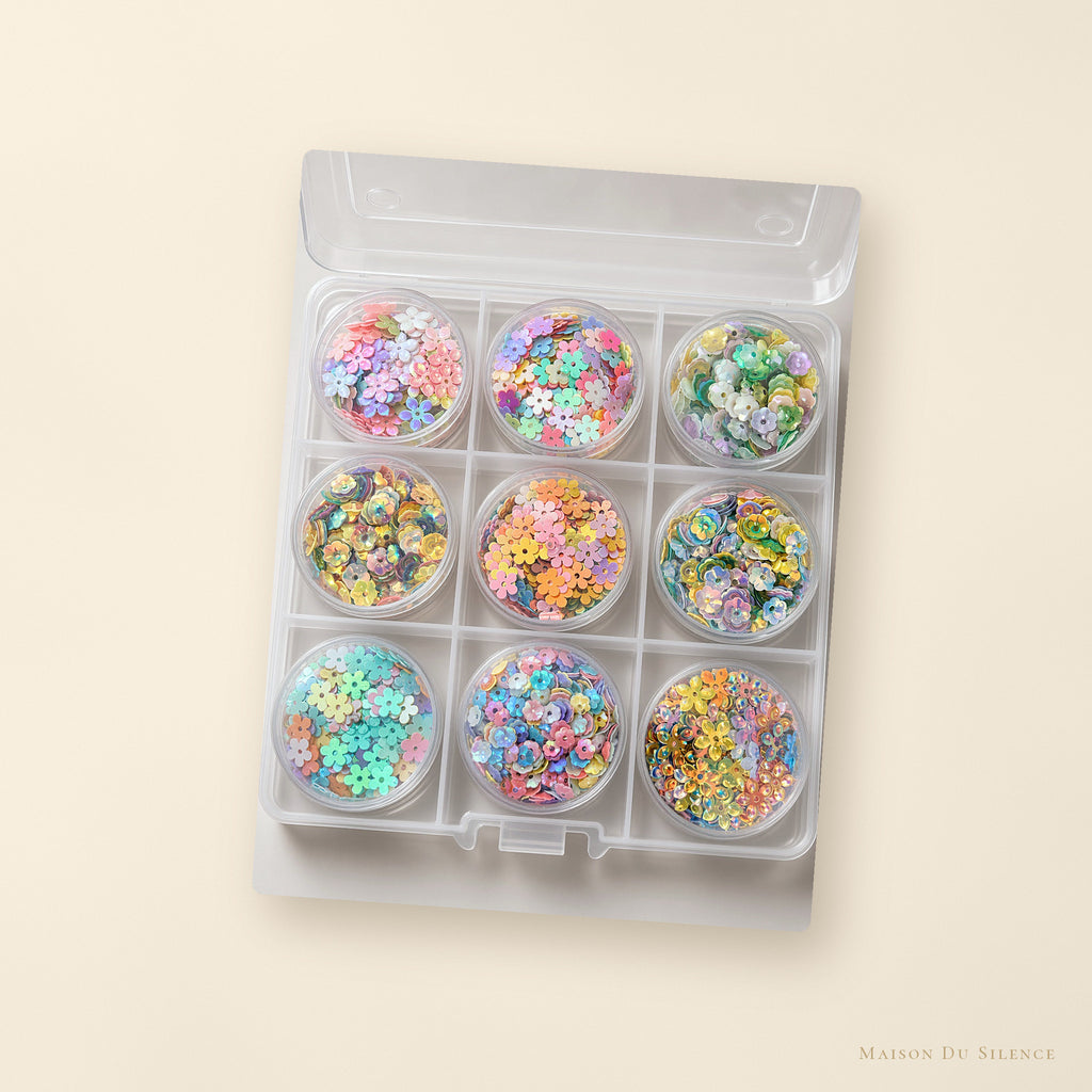 Mystery sequin kit styled on a cream backdrop