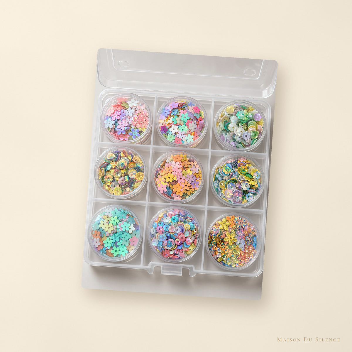 Mystery sequin kit styled on a cream backdrop