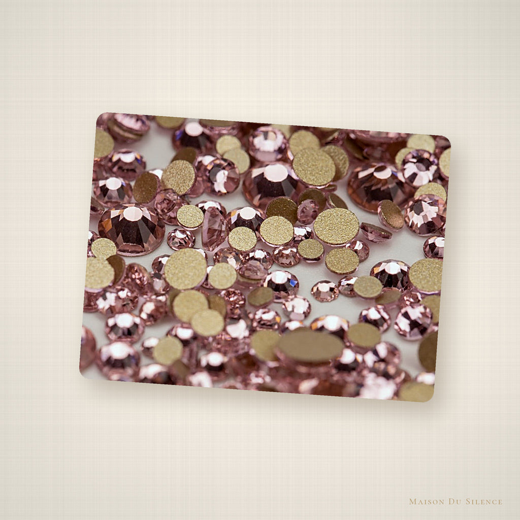 Pink SS10 flatback rhinestones styled on an ivory linen backdrop
